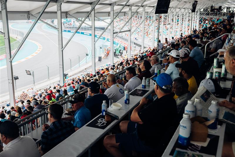 Fans in the grandstands with views of a corner at the Miami Formula 1 Grand Prix circuit