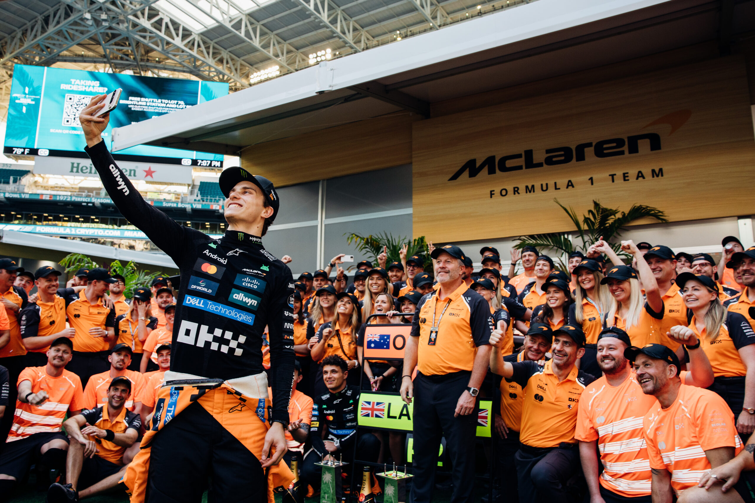 Oscar Piastri takes a selfie with the McLaren team