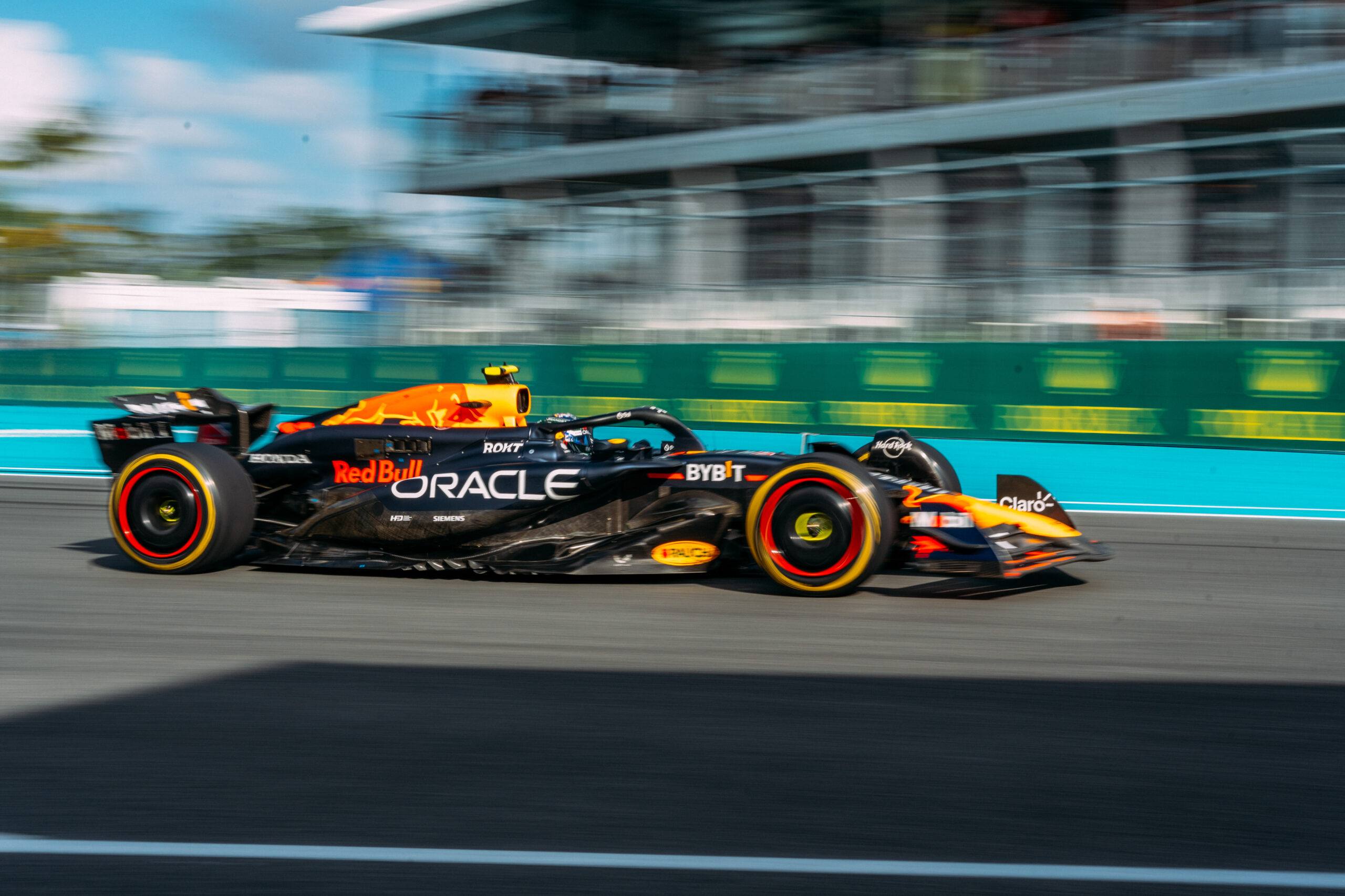 Image of Redbull car racing through the track