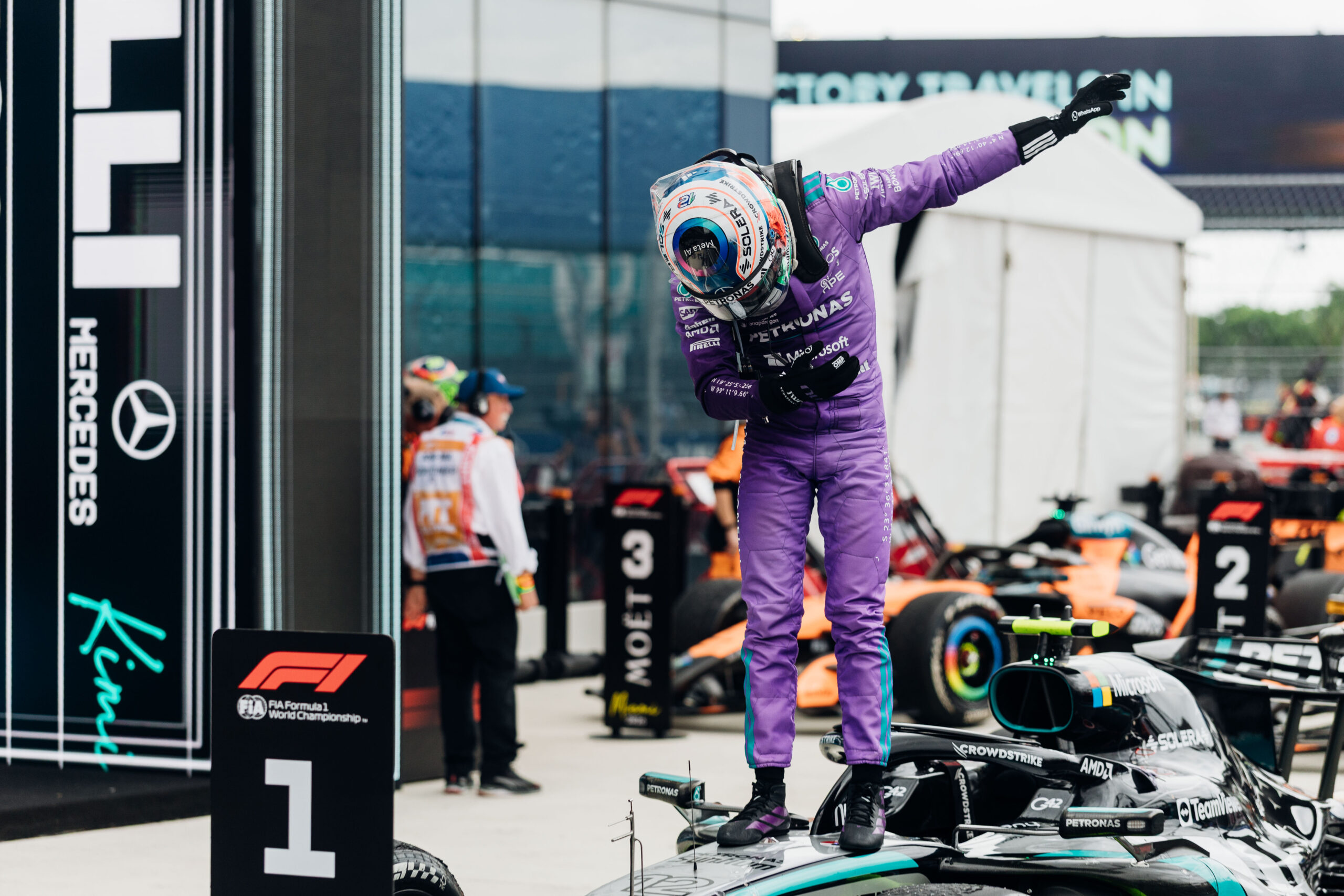 Kimi Antonelli stands on his Mercedes car and celebrates victory after winning the Formula 1 Miami Grand Prix at Miami International Autodrome.