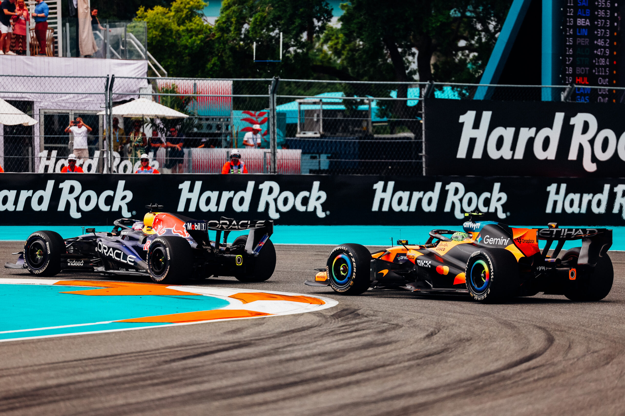 Two cars race by on the F1 Miami GP track